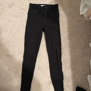 Black Topshop jeans.